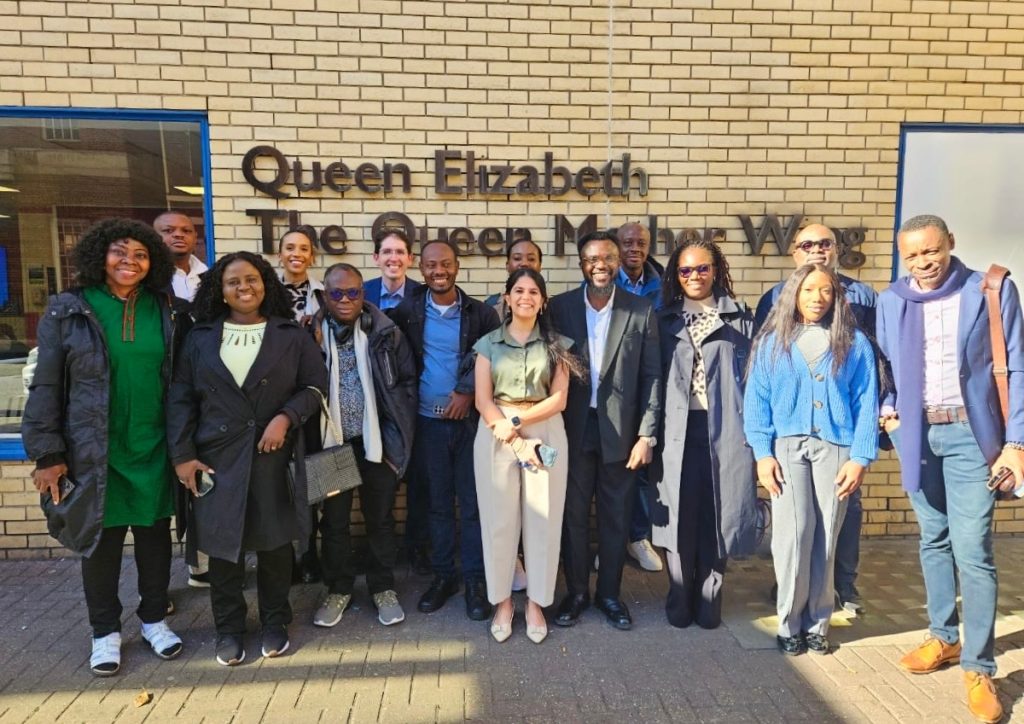 People stand outside Queen Elizabeth Queen Mother Wing at St Mary's Hospital